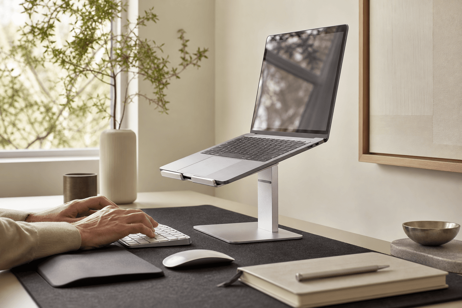 Organised home workspace using a stand, wrist support and cable management